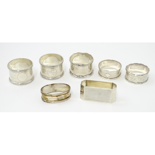 335 - Seven assorted silver napkin rings, various dates and makers to include an Art Deco example hallmark... 