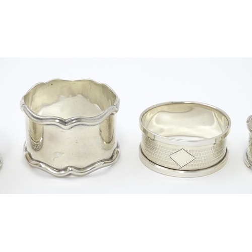 335 - Seven assorted silver napkin rings, various dates and makers to include an Art Deco example hallmark... 