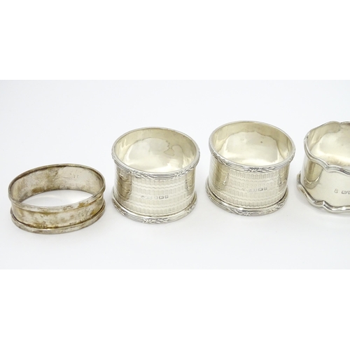 335 - Seven assorted silver napkin rings, various dates and makers to include an Art Deco example hallmark... 