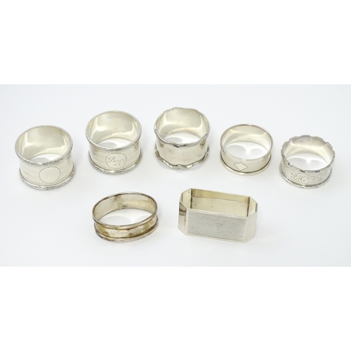 335 - Seven assorted silver napkin rings, various dates and makers to include an Art Deco example hallmark... 