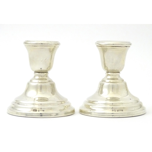 343 - A pair of silver squat candlesticks, hallmarked Birmingham 1963 maker Sanders and MacKenzie, approx ... 