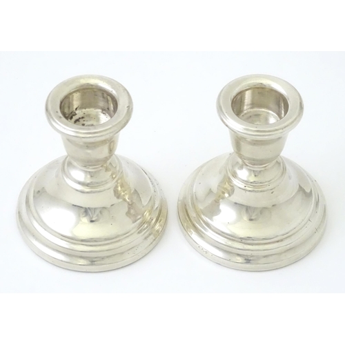 343 - A pair of silver squat candlesticks, hallmarked Birmingham 1963 maker Sanders and MacKenzie, approx ... 