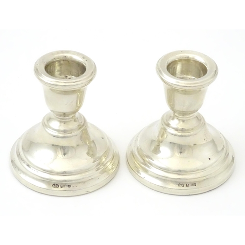 343 - A pair of silver squat candlesticks, hallmarked Birmingham 1963 maker Sanders and MacKenzie, approx ... 