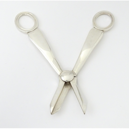 347 - Two silver plate grape scissors / shears. Approx 6 1/2