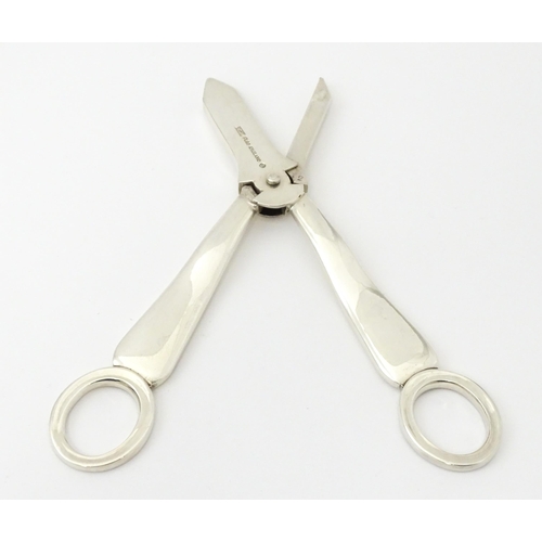 347 - Two silver plate grape scissors / shears. Approx 6 1/2