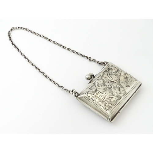 366 - A silver coin purse on chain with engraving scrolling foliate decoration, hallmarked Birmingham 1909... 