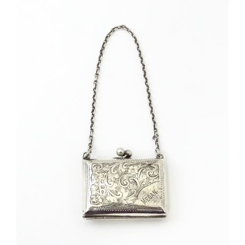 366 - A silver coin purse on chain with engraving scrolling foliate decoration, hallmarked Birmingham 1909... 