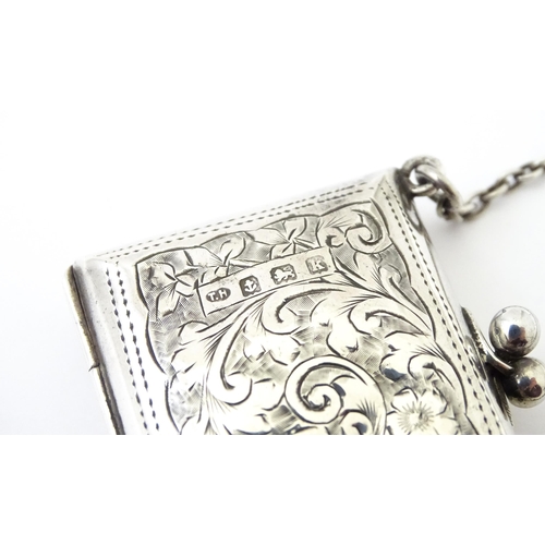 366 - A silver coin purse on chain with engraving scrolling foliate decoration, hallmarked Birmingham 1909... 