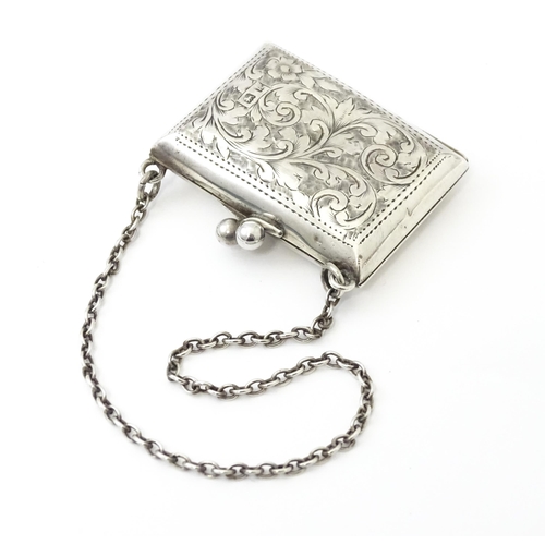 366 - A silver coin purse on chain with engraving scrolling foliate decoration, hallmarked Birmingham 1909... 