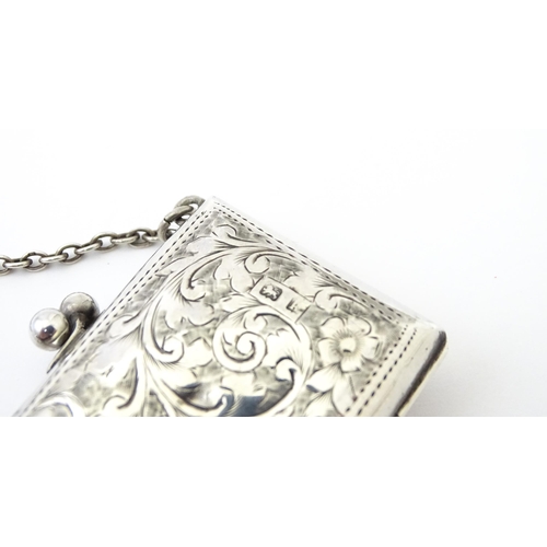 366 - A silver coin purse on chain with engraving scrolling foliate decoration, hallmarked Birmingham 1909... 