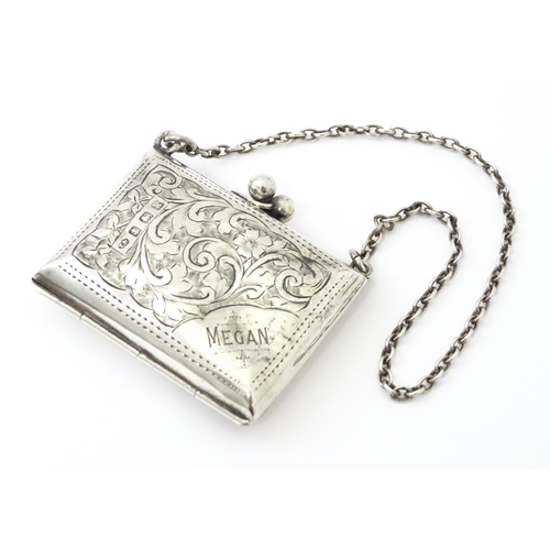 366 - A silver coin purse on chain with engraving scrolling foliate decoration, hallmarked Birmingham 1909... 