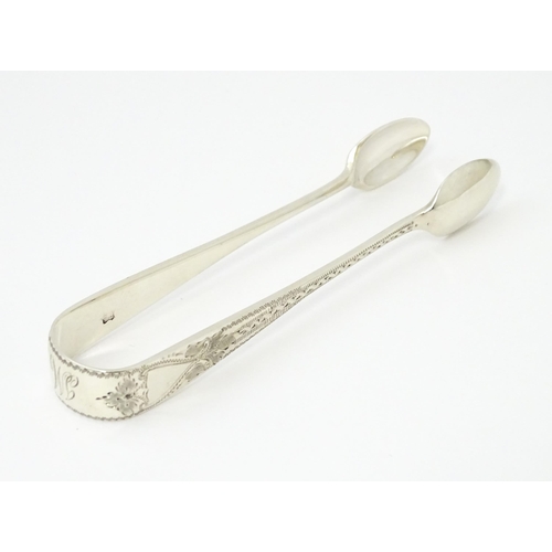 429 - Silver sugar tongs with bright cut engraved decoration Hallmarked London 1901 maker Josiah Williams ... 