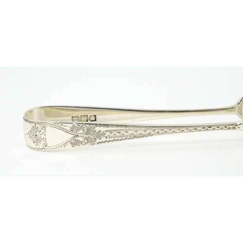 429 - Silver sugar tongs with bright cut engraved decoration Hallmarked London 1901 maker Josiah Williams ... 