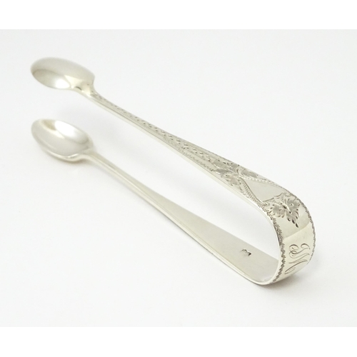 429 - Silver sugar tongs with bright cut engraved decoration Hallmarked London 1901 maker Josiah Williams ... 