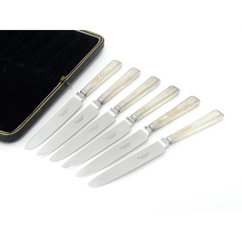 490 - A cased set of six silver handled tea / butter knives hallmarked Sheffield 1932, maker Thomas Bradbu... 