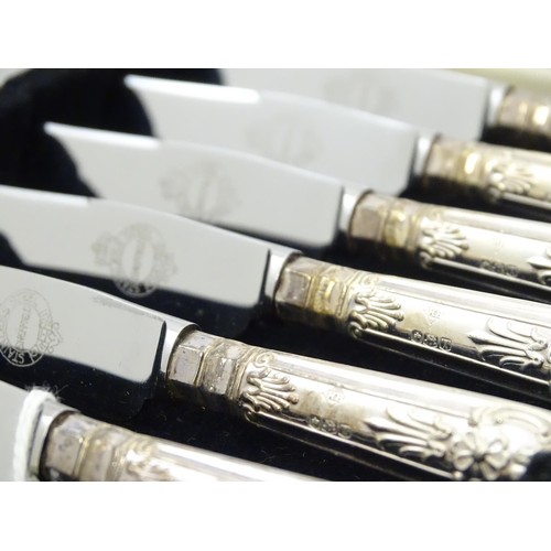 491 - A cased set of six silver handled tea knives, hallmarked Sheffield 1961, maker Harrison Brothers. Ca... 