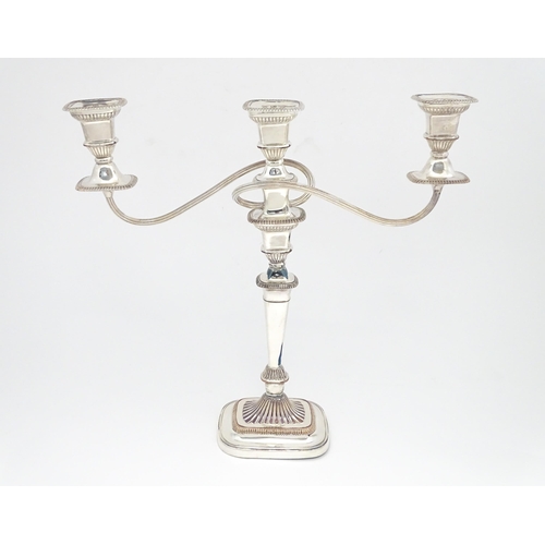 519 - A large silver plate three branch table candelabra. Approx. 17 1/2