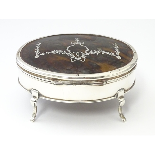 227 - A silver jewellery box of oval form with tortoiseshell and pique work detail to lid, hallmarked Lond... 