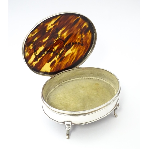 227 - A silver jewellery box of oval form with tortoiseshell and pique work detail to lid, hallmarked Lond... 