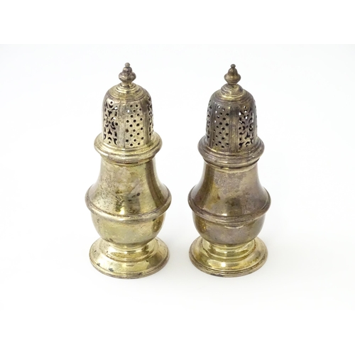 234 - A pair of silver pepperettes hallmarked London 1928 / 1929, maker William Comyns & Sons Ltd. Approx.... 