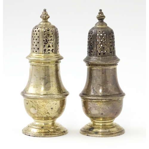 234 - A pair of silver pepperettes hallmarked London 1928 / 1929, maker William Comyns & Sons Ltd. Approx.... 