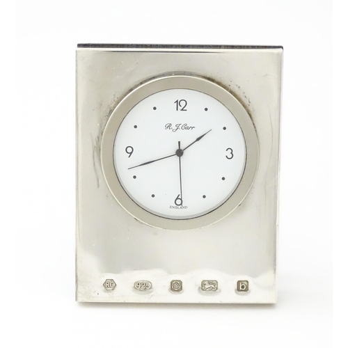 236 - An easel back clock with a silver surround hallmarked Sheffield 2001, maker Carrs of Sheffield. Appr... 