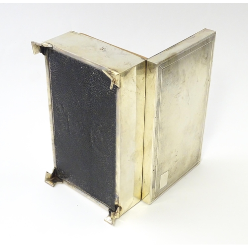 239 - A silver table top cigarette box with engine turned decoration opening to reveal a cedar lined inter... 