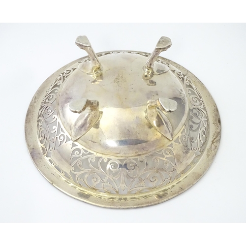 244 - A large silver bon bon dish / fruit dish with pierced scroll detail, standing on four lion paw feet,... 