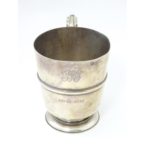 250 - A silver tankard with banded detail hallmarked Birmingham 1938, Henry Pidduck & Sons. Approx. 5