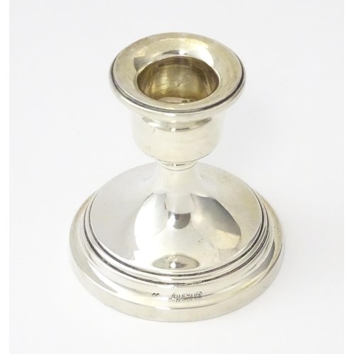 263 - A silver candlestick of squat form, hallmarked Birmingham 1929. Approx. 2 1/4