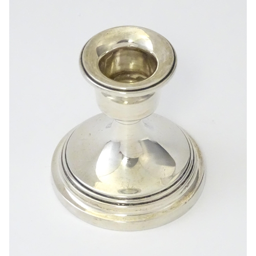 263 - A silver candlestick of squat form, hallmarked Birmingham 1929. Approx. 2 1/4