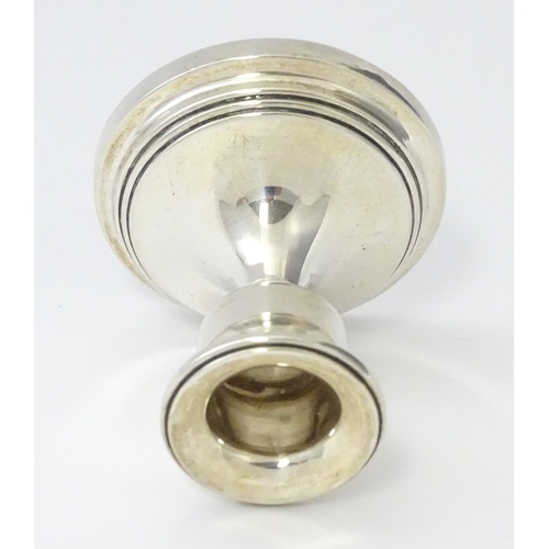 263 - A silver candlestick of squat form, hallmarked Birmingham 1929. Approx. 2 1/4