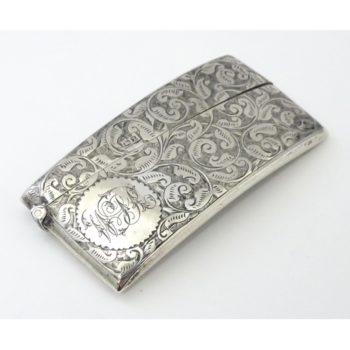 267 - A Victorian silver card case of shaped form with engraved acanthus scroll detail, hallmarked Birming... 