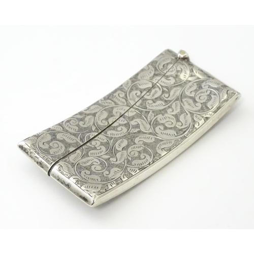 267 - A Victorian silver card case of shaped form with engraved acanthus scroll detail, hallmarked Birming... 