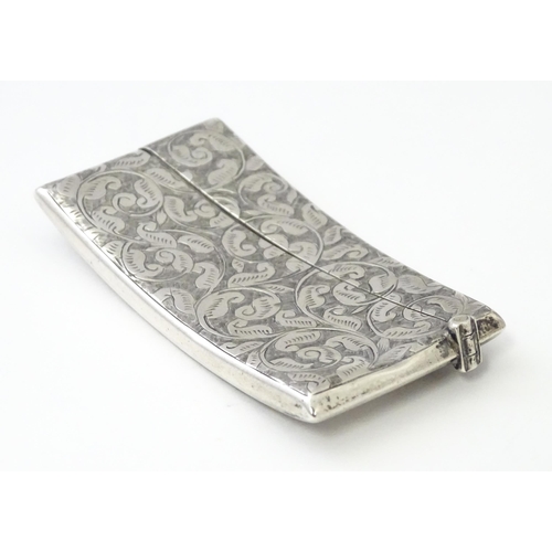 267 - A Victorian silver card case of shaped form with engraved acanthus scroll detail, hallmarked Birming... 