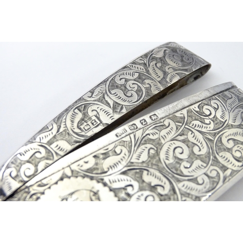 267 - A Victorian silver card case of shaped form with engraved acanthus scroll detail, hallmarked Birming... 