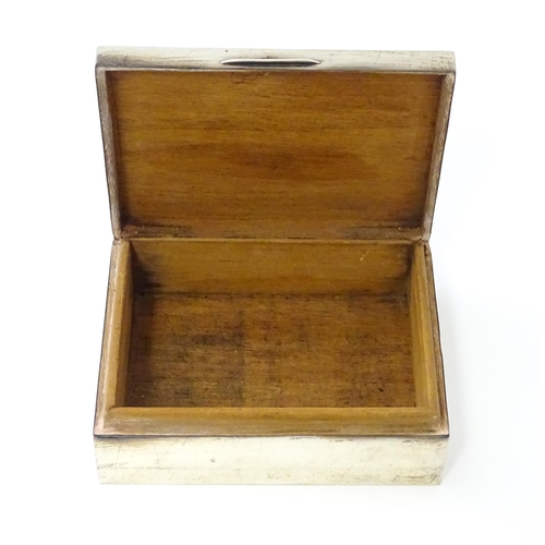 276 - A silver table top cigarette box with engine turned decoration opening to reveal a cedar lined inter... 