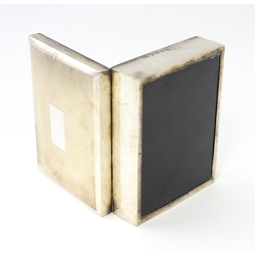 276 - A silver table top cigarette box with engine turned decoration opening to reveal a cedar lined inter... 