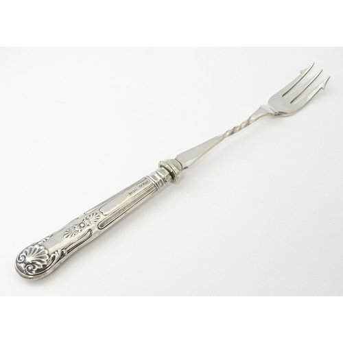 283 - A silver handled pickle fork. Approx. 7 3/4