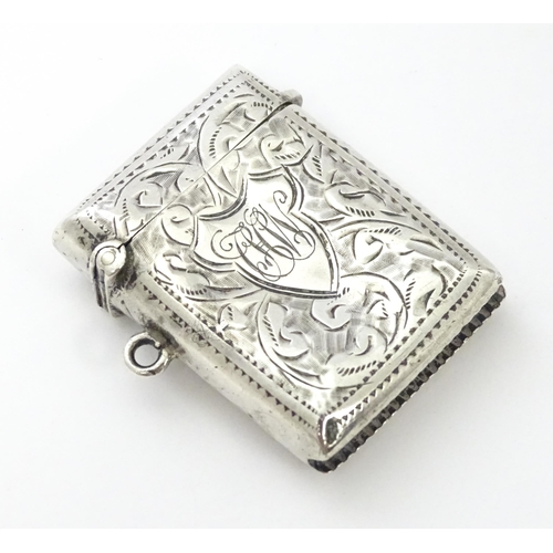 288 - A silver vesta case with engraved decoration, hallmarked Birmingham 1912, maker John Rose. Approx. 1... 