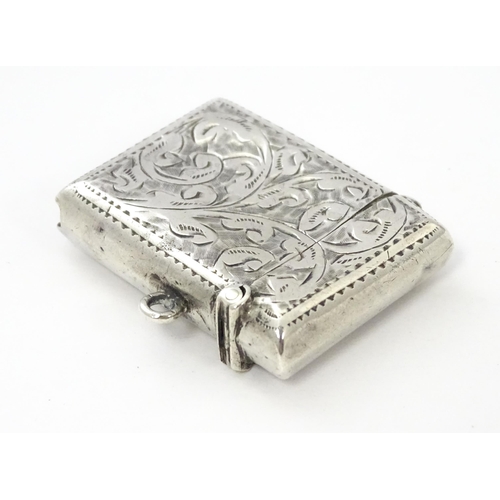 288 - A silver vesta case with engraved decoration, hallmarked Birmingham 1912, maker John Rose. Approx. 1... 