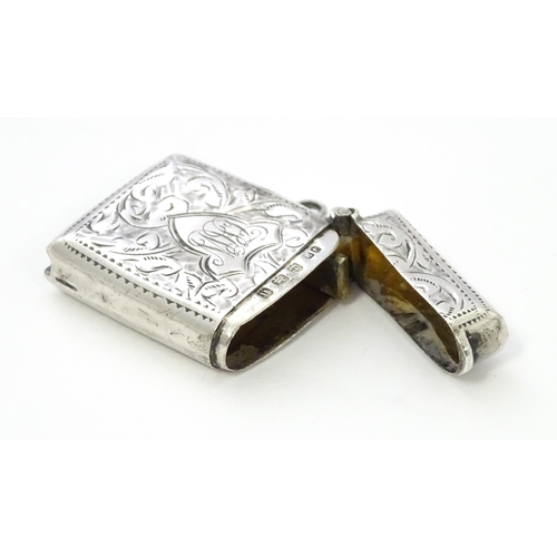 288 - A silver vesta case with engraved decoration, hallmarked Birmingham 1912, maker John Rose. Approx. 1... 