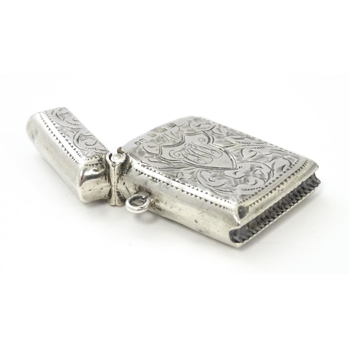 288 - A silver vesta case with engraved decoration, hallmarked Birmingham 1912, maker John Rose. Approx. 1... 