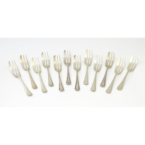 295 - A set of twelve silver cake / pastry forks, hallmarked Sheffield 1947, maker Viner’s Ltd. - Approx. ... 