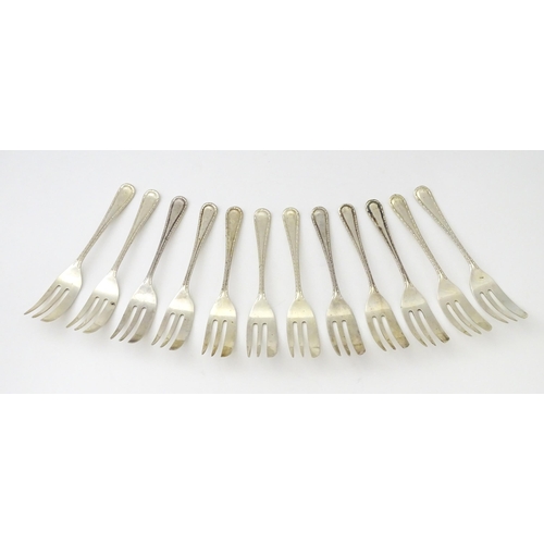 295 - A set of twelve silver cake / pastry forks, hallmarked Sheffield 1947, maker Viner’s Ltd. - Approx. ... 