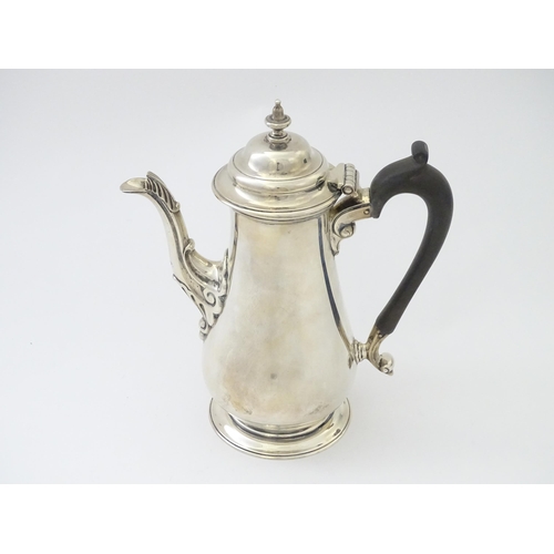 309 - A silver coffee pot hallmarked London 1906 maker Harrison Brothers & Howson. Approx 8