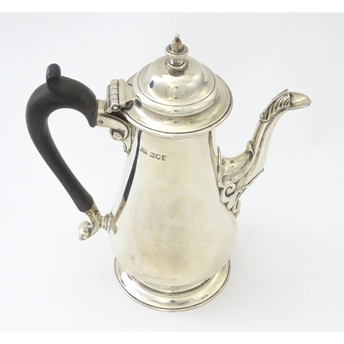 309 - A silver coffee pot hallmarked London 1906 maker Harrison Brothers & Howson. Approx 8