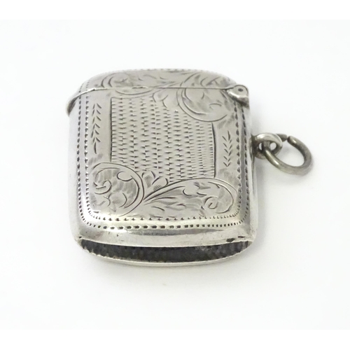 311 - A silver vesta case with engraved decoration, hallmarked Birmingham 1908, maker William Hair Haseler... 