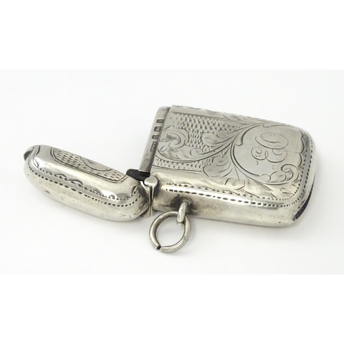 311 - A silver vesta case with engraved decoration, hallmarked Birmingham 1908, maker William Hair Haseler... 