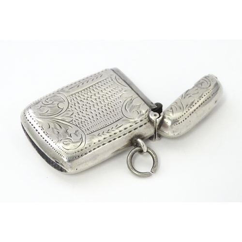 311 - A silver vesta case with engraved decoration, hallmarked Birmingham 1908, maker William Hair Haseler... 